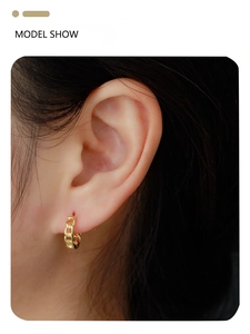 Model wearing gold S925 sterling silver chain link hoop earrings in a close-up shot