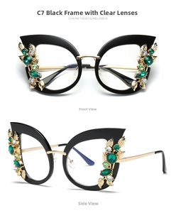 Detailed view of oversized cat-eye frames with green gems and gold leaf ornaments