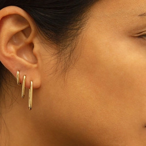 Classic minimalist gold U-shaped silver drop earrings shown on model for elegant style