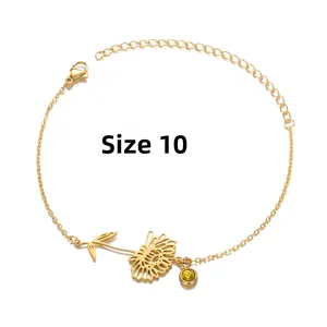 Detail of gold sunflower bracelet with yellow gemstone and lobster clasp closure