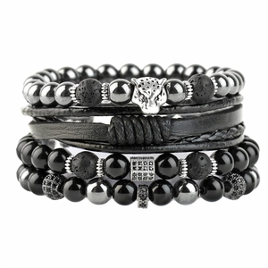 Detail of four-piece men's punk bracelet set with tiger eye, lava stone and woven leather
