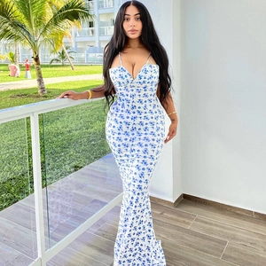 Floral print summer maxi dress in white and blue featuring slim fit and spaghetti straps