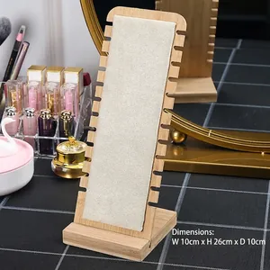 Bamboo necklace display stand with microfiber lining showing side notches on a vanity