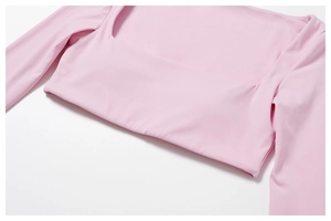 Close-up of square neckline and texture on pink long-sleeve athletic cropped top