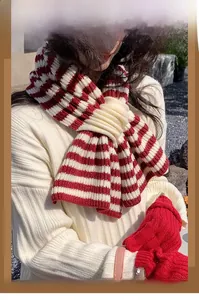 Macro detail of thick red and white striped knit scarf texture with wool blend material