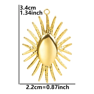 Detail view of a 18k gold plated sun pendant with exact dimensions 3.4cm by 2.2cm
