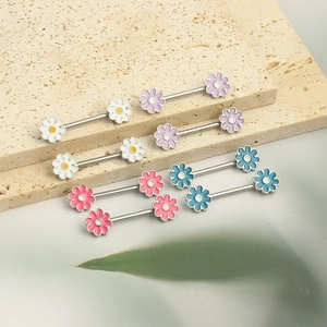 Detailed macro view of daisy nipple barbells in white, purple, pink and blue colors