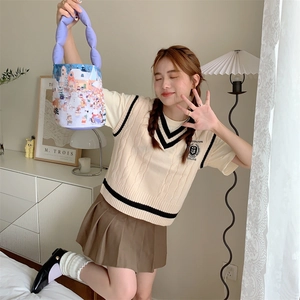 Detail of creative canvas bucket bag with purple padded handles and winter town illustration