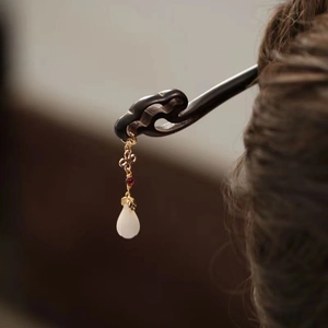 Elegant ebony wood hair pin with gold chain and jade pendant for traditional updo