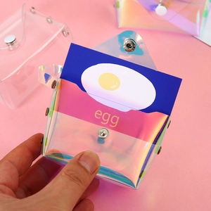 Laser PVC mini pouch for coins and cards with fried egg design in hand-held view