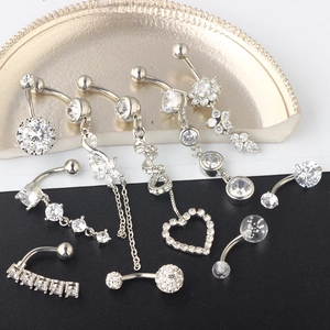 Detailed set of silver navel rings featuring heart, flower and tassel zircon charms