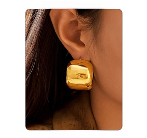 Close-up of model wearing large square gold-plated C-shaped stainless steel earrings