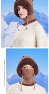 Detail of dark brown knit winter hat with thick faux fur trim and adjustable drawstring