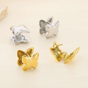 Detailed view of 3D butterfly hoop earrings in gold and silver showing hinge mechanism