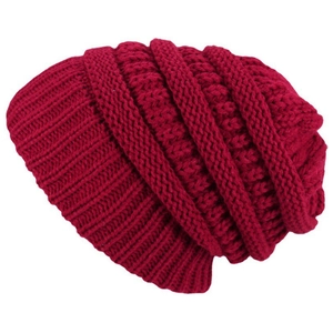 Close-up of dark red winter beanie showing thick knit texture and soft yarn details