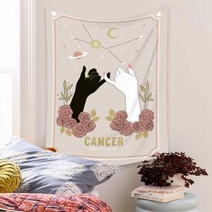 Detail of bohemian Cancer zodiac tapestry featuring pink roses and hands pinky swear gesture