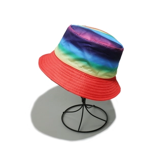 Detailed view of rainbow striped bucket hat with red brim and decorative stitching