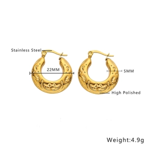 Detail view of 22mm gold high polished stainless steel C-shaped hoop earrings