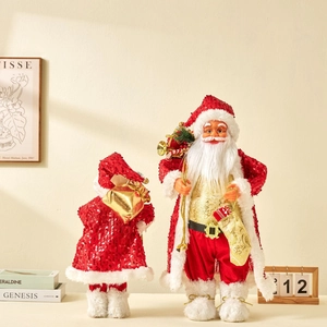 Set of two standing Santa Claus dolls in red sequined outfits with gold gift bags