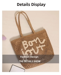Detail showing 'Bon jour' embroidery on brown woven straw tote bag for beach vacation