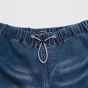 Mid-rise wide-leg loose blue jeans with elastic waist and white drawstring closure