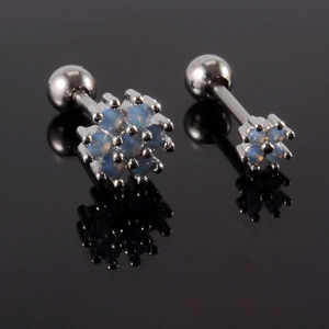 Detailed macro view of opal flower stud earrings with screw-back ball closures