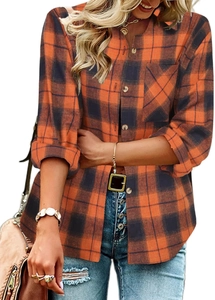 Detail of orange and black plaid shirt with button collar and single chest pocket