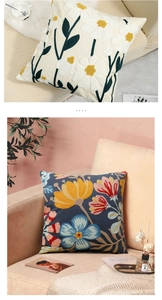 Detail of floral towel embroidery on beige and navy cushions for home decor