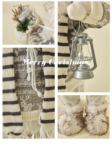 Detail of Nordic Santa figure showing knit sweater with deer and vintage grey lantern