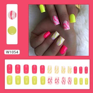Detail of neon yellow and pink press-on nails in short square shape with wavy patterns
