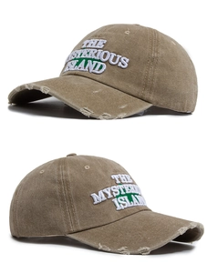 Close-up of khaki distressed baseball cap with 3D embroidery and worn-out details