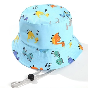 Kids light blue bucket hat with colorful dinosaur patterns and adjustable chin strap