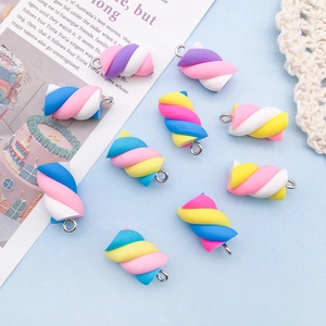 Macro view of colorful resin marshmallow pendants with silver rings for DIY crafts