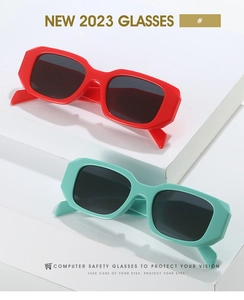 Fashionable square chunky sunglasses in red and green with geometric faceted frames