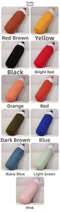 Macro view of plush teddy velvet pencil pillows in eleven vibrant colors for home decor
