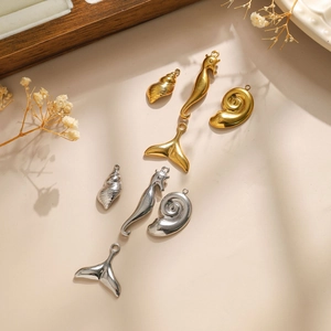 18K gold plated stainless steel sea creature pendants featuring seahorse and seashell shapes