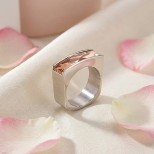 Detail view of champagne square-cut glass gemstone set on a brushed silver ring band