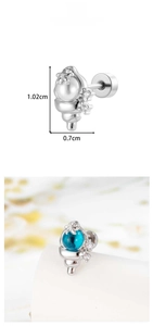 Macro detail of conch shell earring with sparkling zircon stars and product dimensions