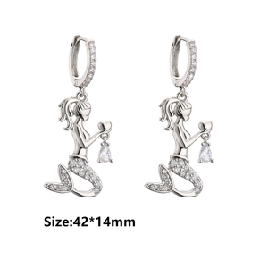 Detailed view of silver mermaid earrings with micro zircons and clear crystal drops