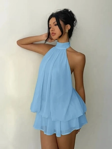 Detail of the sky blue halter neck chiffon dress with a layered double ruffle bubble hem
