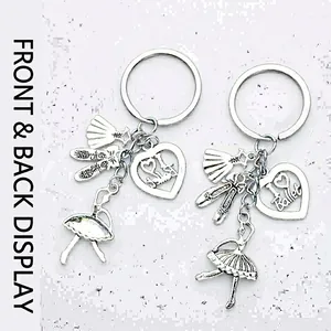 Elegant ballerina keychain pair with ballet shoes and I Love Ballet heart pendants
