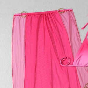 Detail of pink mesh sarong with a gold metal ring buckle and gradient bikini top