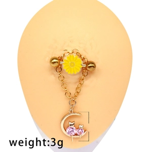 Detail of nipple ring featuring pink rhinestone cat on moon and yellow daisy chain, 3g