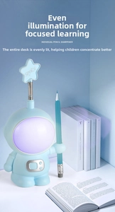 Blue astronaut desk lamp with pencil sharpener and star detail for kids' study rooms