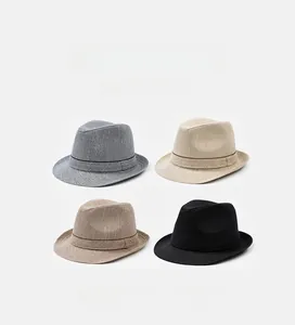 Detailed grid view of four different color woven fedoras with stylish ribbon bands