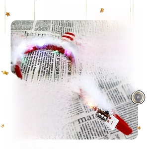 Detail of Christmas LED headband with white feathers and replaceable AG13 battery compartment