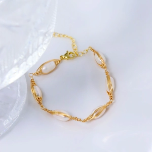 Handmade wire-wrapped natural pearl bracelet with gold metal wire and lobster clasp