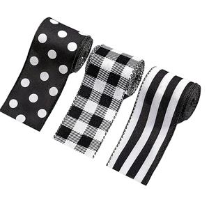 Set of three black and white patterns Christmas ribbons with buffalo plaid and polka dots