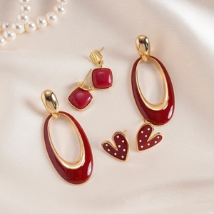 Six-piece earring set featuring red enamel heart, square, and oval gold-tone shapes