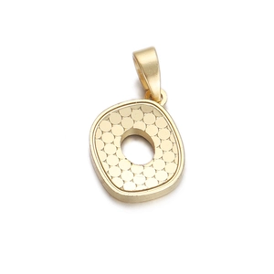 Minimalist gold textured round pendant with honeycomb pattern and bail on white background